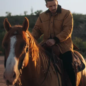 A Man in a Cattleman Jacket on a Horse