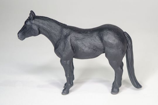 A Horse Figure in grey on a White Surface