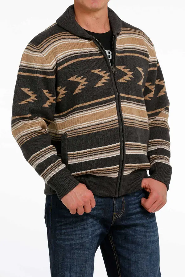 A Man in a Black Sweater With Brown and White Pattern