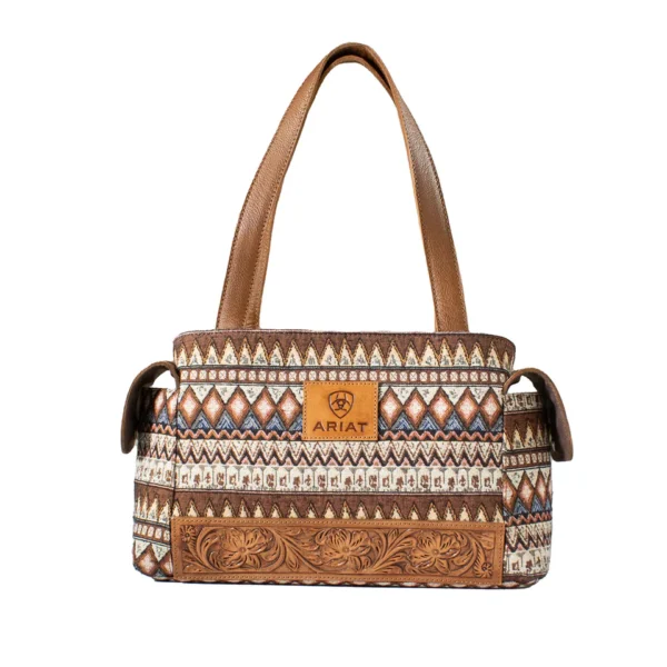 A brown and white purse with a leather strap.