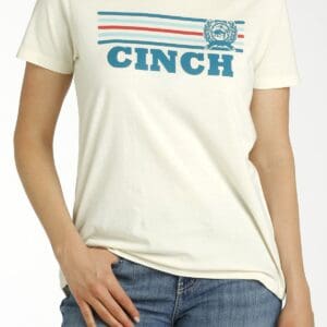 A woman wearing jeans and a white t-shirt.