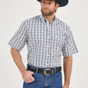 A man wearing jeans and a cowboy hat.