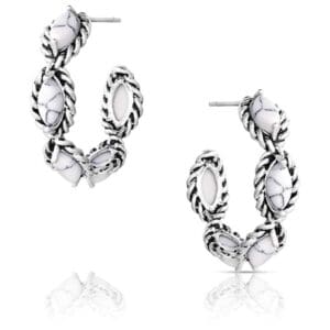 A pair of white hoop earrings with silver accents.