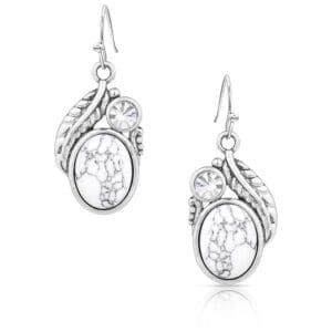 A pair of earrings with white stones and leaves.