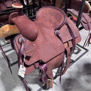 Calf roping saddle with a team roping horn