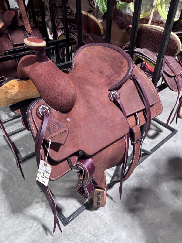 Calf roping saddle with a team roping horn