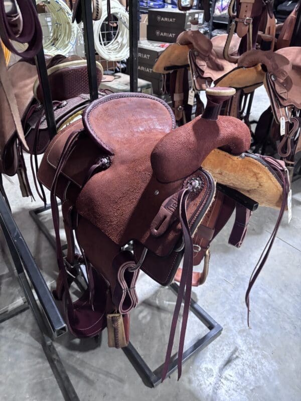 Calf roping saddle with a team roping horn